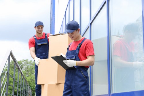 Removal van and moving boxes in a residential Ealing street