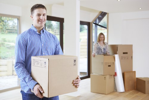 Packed moving boxes and furniture ready for transport