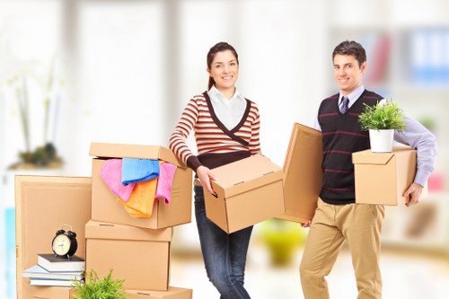 Moving team preparing furniture for transport in Ealing
