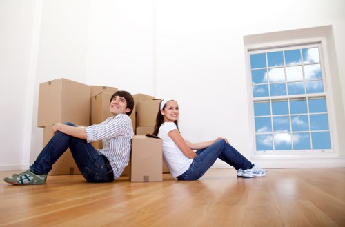 Loading office items for transport during a move in Ealing