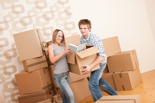 Office desks and boxes arranged for transport during an Ealing business move