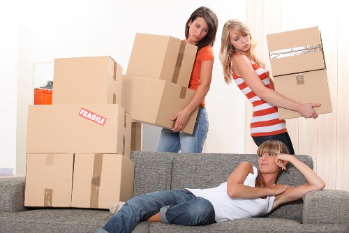 Office furniture and boxes prepared for a commercial move in Ealing
